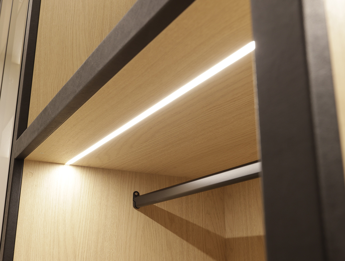 Custom closet mirror system with handcrafted frames and premium wardrobe lighting solutions